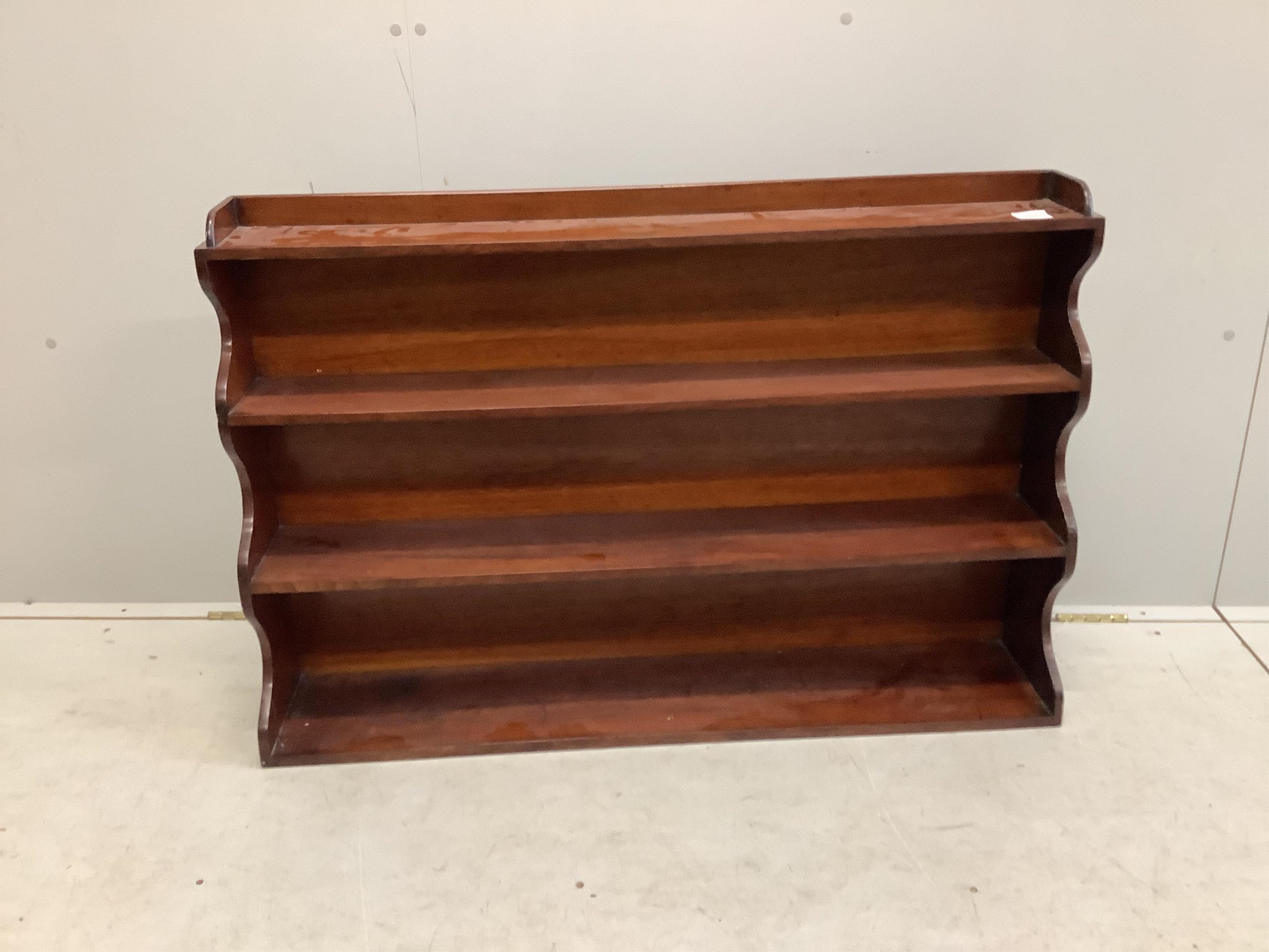 A Victorian mahogany four tier wall bracket, width 108cm, height 71cm. Condition - good